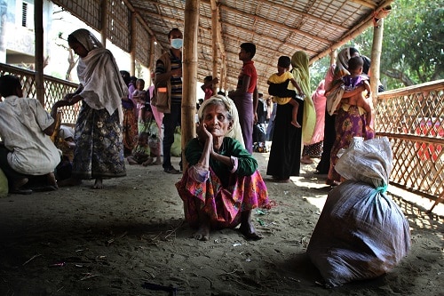 Subi Katum, 70, arrives near Sabrang on the Bangladeshi side of the Naf river after crossing the border from Myanmar on 7 March 2018. Photo: Sara Creta/MSF
