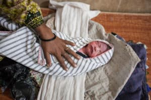 A newborn baby at the MSF facility at the DHQ Hospital in Dera Murad Jamali on 16 November 2018, is swaddled by her grandmother ahead of being taken home.