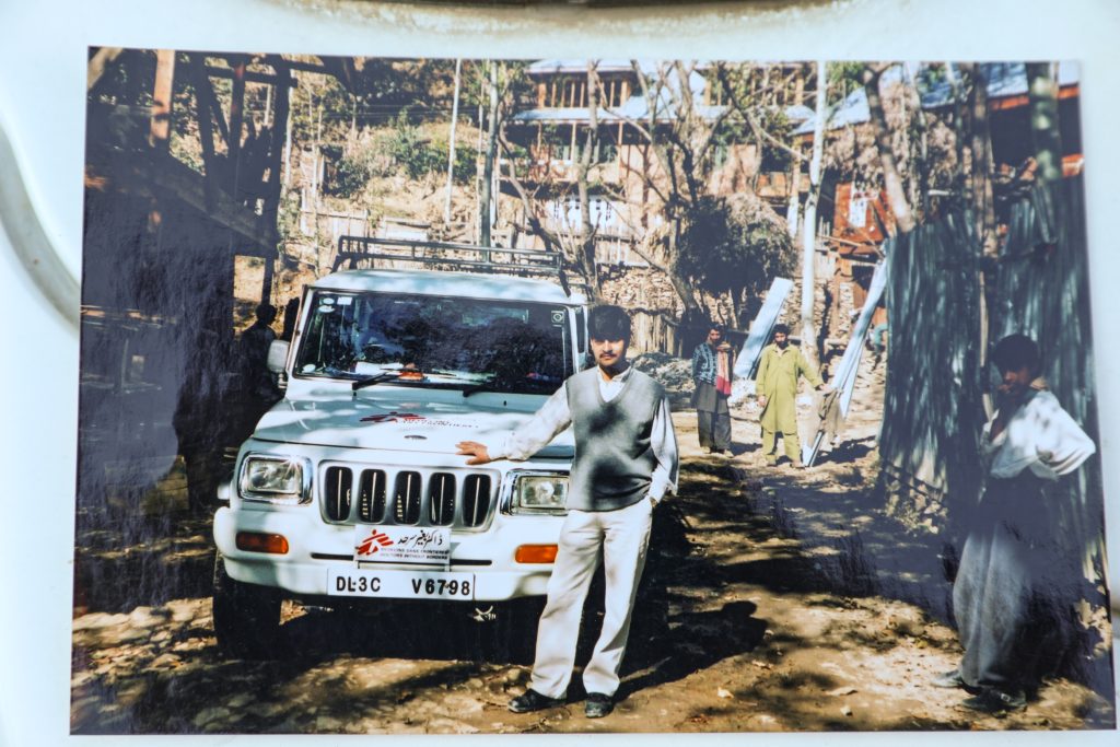 Mohammad Yakoob, Doctors Without Borders India/Médecins Sans Frontières (MSF) driver, stands beside an MSF vehicle in his initial days after joining the MSF mental health project in Kashmir. Yakoob provides transportation support enabling mental health teams to reach communities across the region.